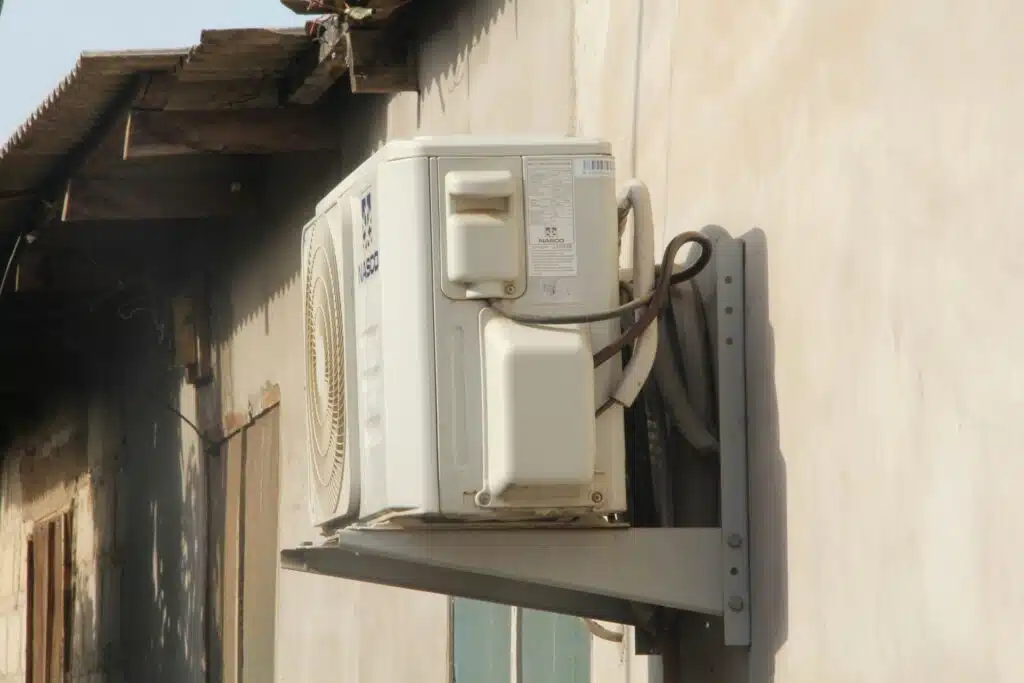 Worn air conditioning condenser being repaired by a Rio Grande Valley AC technician