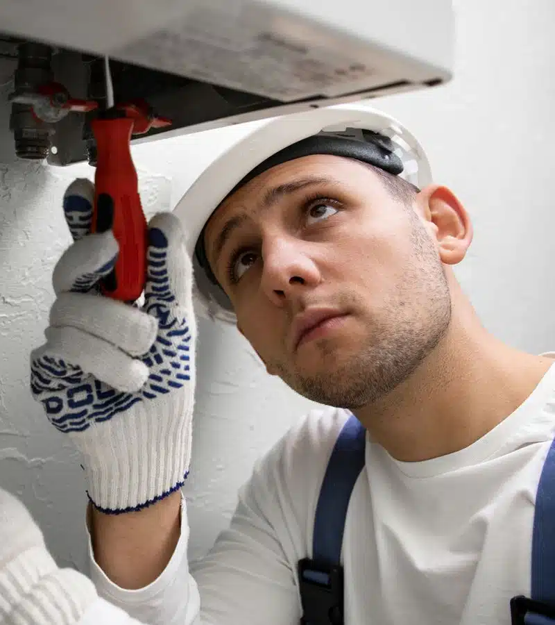 WW Air Specialist technician performing preventative HVAC maintenance