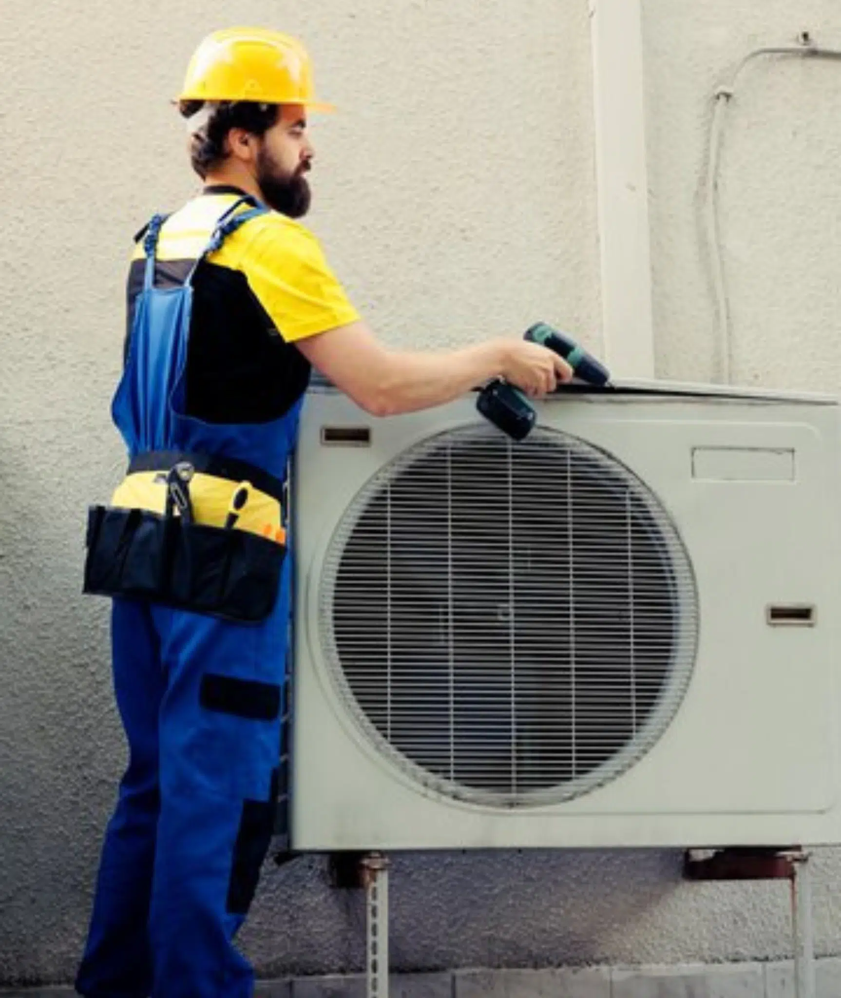 HVAC technician servicing an air conditioning unit in a home in Harlingen, TX